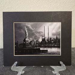 Matted pucture of the twin towers and statue of liberty
