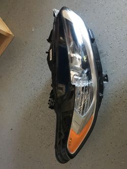 2015 Ford Fusion right headlight mount is broken