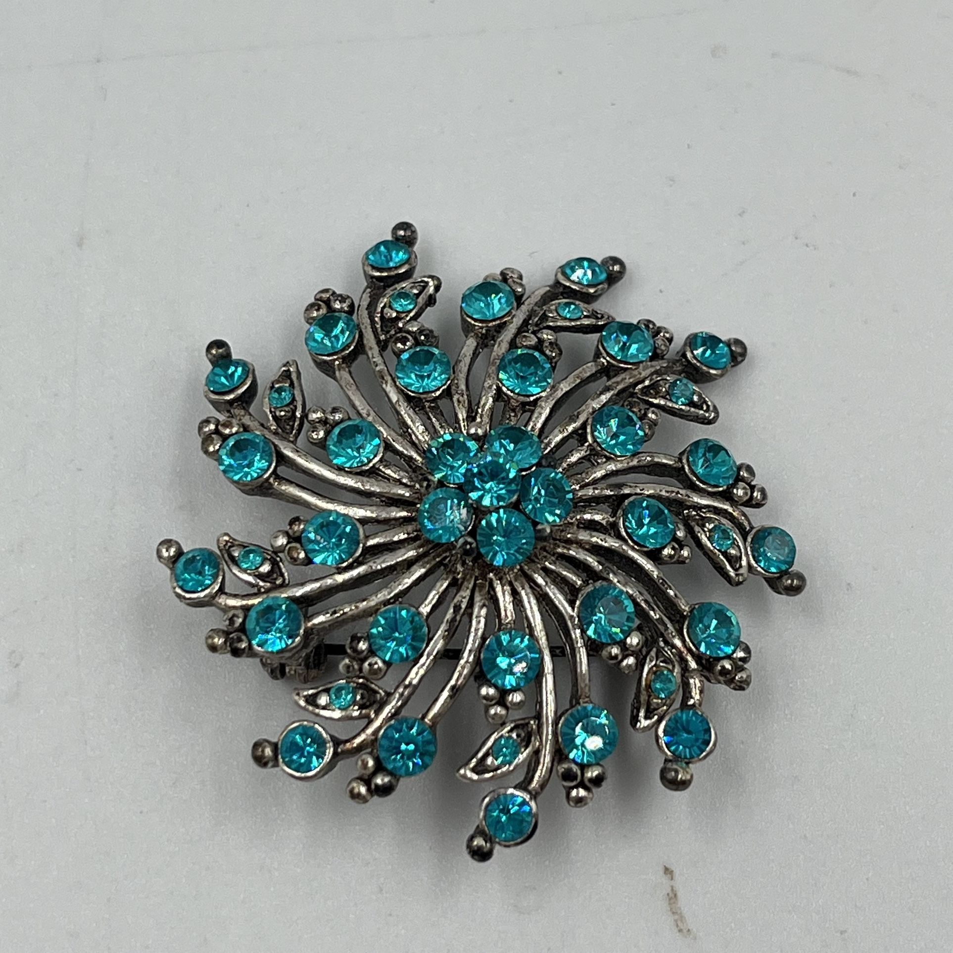Vintage Silver-tone Brooch w/ Floral Pinwheel Design Featuring Aqua Blue Rhinestones