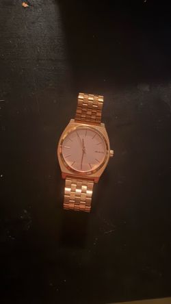 Rose gold face Nixon watch