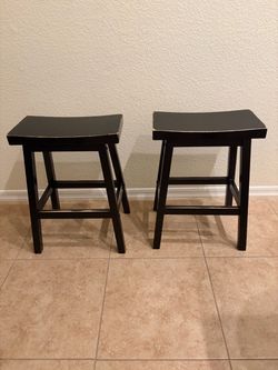 Pair of Black Wooden Saddle Counter Stools