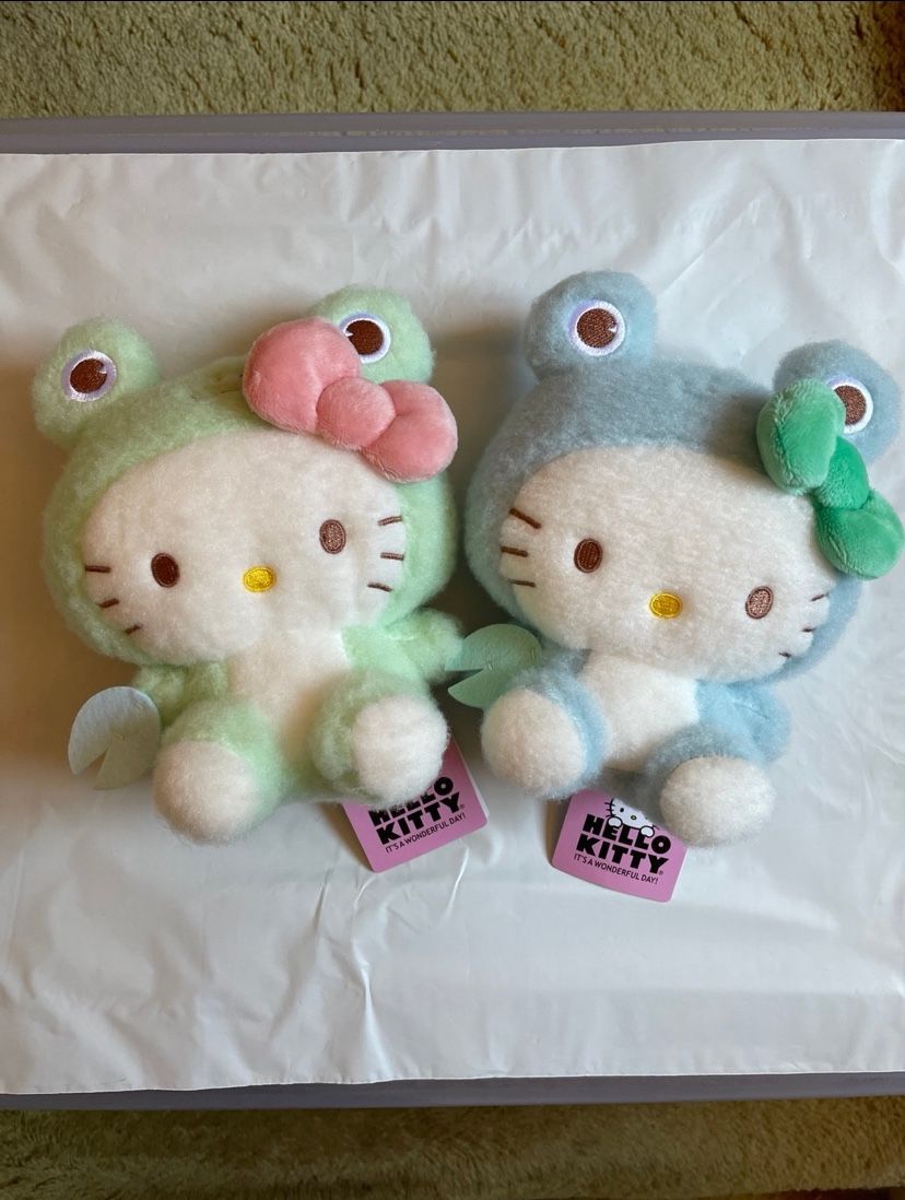 Hello Kitty, frog ground one I have two greens and one blue $39.99 each