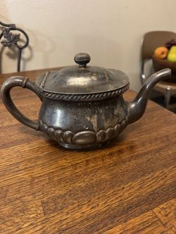an antique Gorham silver-plated creamer or teapot with a soldered lid