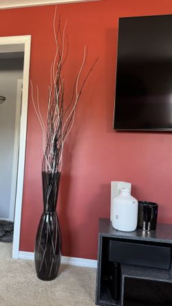 Tall black clear glass vase with decor twigs included