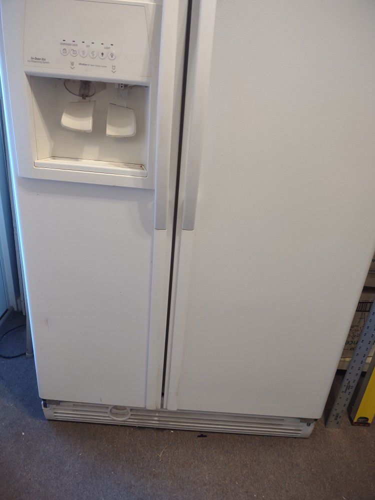 Great Garage Refrigerator, fullsize
 white side by side whirlpool Gold.
 Ice and water on door