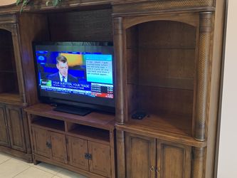 Gorgeous entertainment center!! Solid wood in great condition.