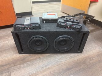 Kicker Amplifiers and Pioneer Flip out Screen and 2 8” Audio Control Subwoofers on Box