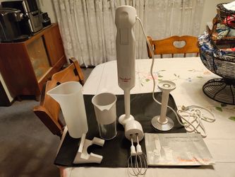 Turbo emulsion stick blender. Attachments with beaters and hook to hang on wall. Downsizing as we have 2. Great shape