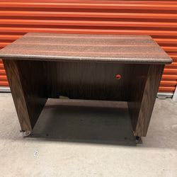 Rolling office desk/workstation with laminate top – solid wood finish – good condition