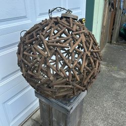 Beautiful wooden mid-century modern looking light fixture approximately ball shaped and  approximately 2 feet across and in good shape. Has plug but c