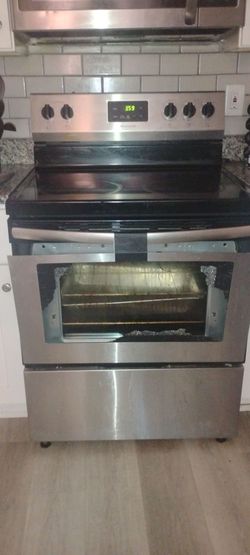 Frigidaire stove top and a chalkboard easel