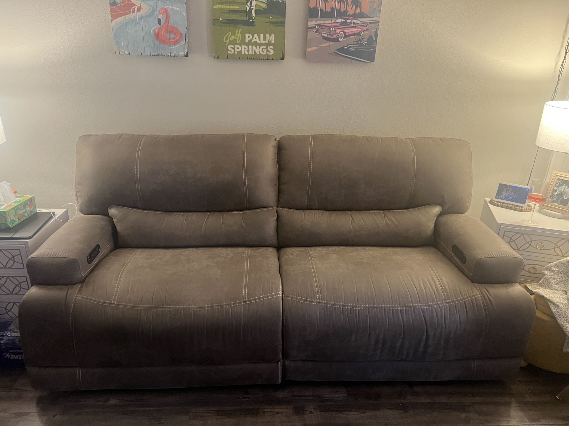 Brown power recliner with USB ports on both sides