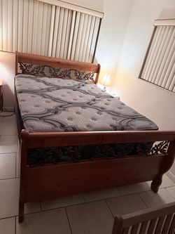 Knotty Pine Queen Bed Frame with Leaf Pattern Steel Trim