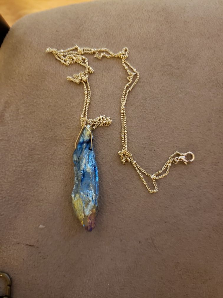 Colorful rock necklace on gold chain