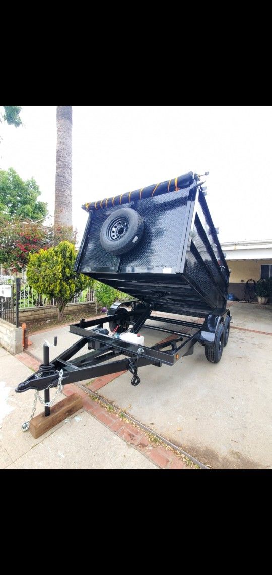 BRAND NEW DUMP TRAILER 8X12X4 12,000 LBS HYDRAULIC SYSTEM ROLLING TARP AND SPARE TIRE LED LIGHTS TITLE IN HAND READY FOR WORK FOR ANY QUESTION TEXT ME