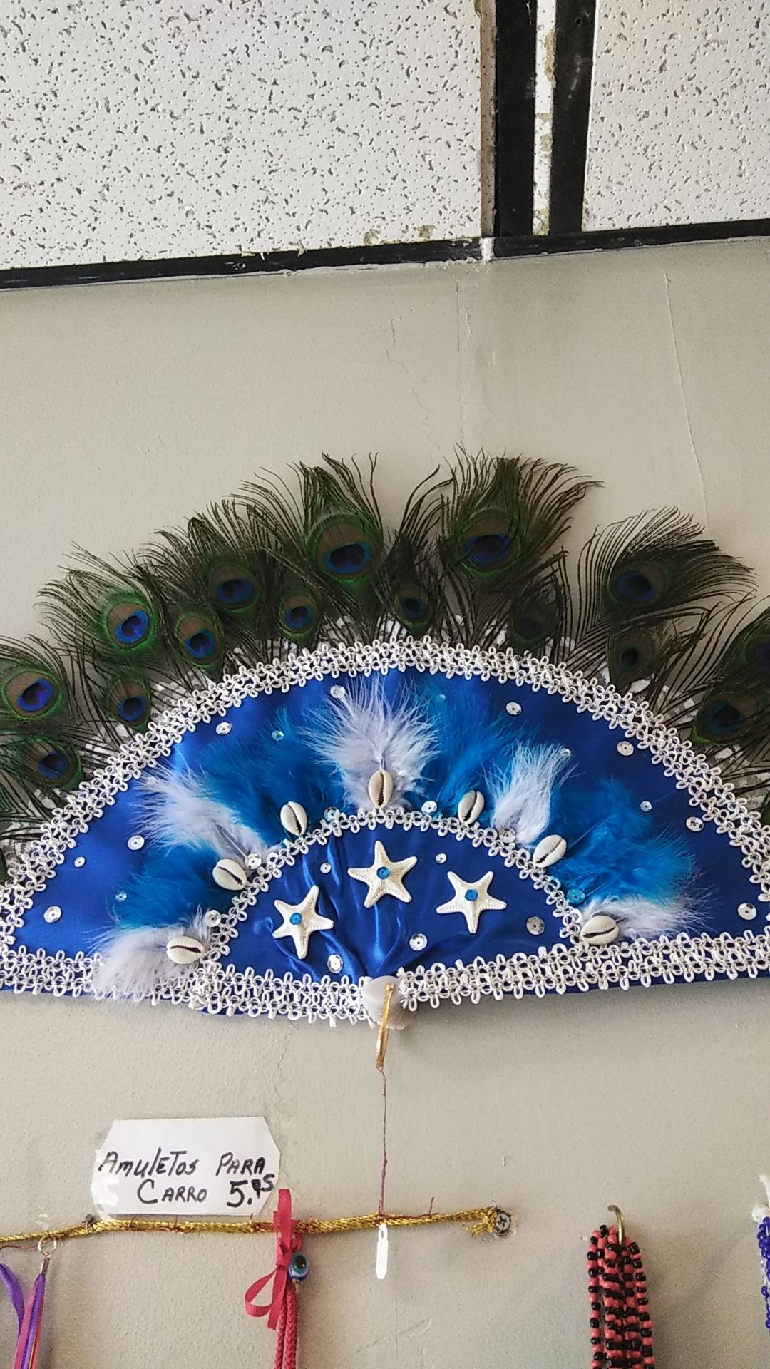 Abanico de Yemaya con 21 plumas de Pavo Real