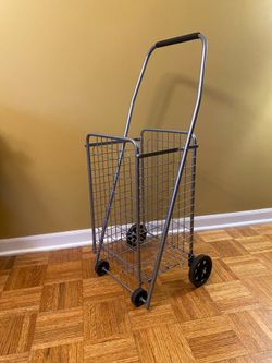 Foldable shopping cart with wheels/See all pictures posted. Good condition. Pick up in Lake Zurich.
