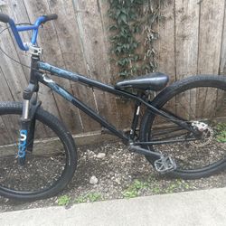 One 29 Inch On Fixie Crank And One 26 Inch On Disc Brakes And Shocks 