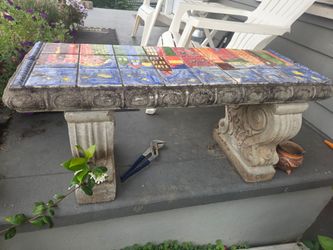Garden bench, bird bath and Otters