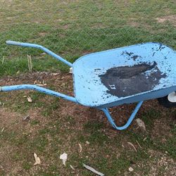 used, light blue, single-wheeled wheelbarrow