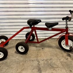 Red 6-wheel kids tandem ride-on