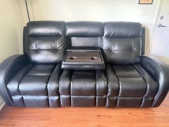 City Furniture leather couches and dining table.