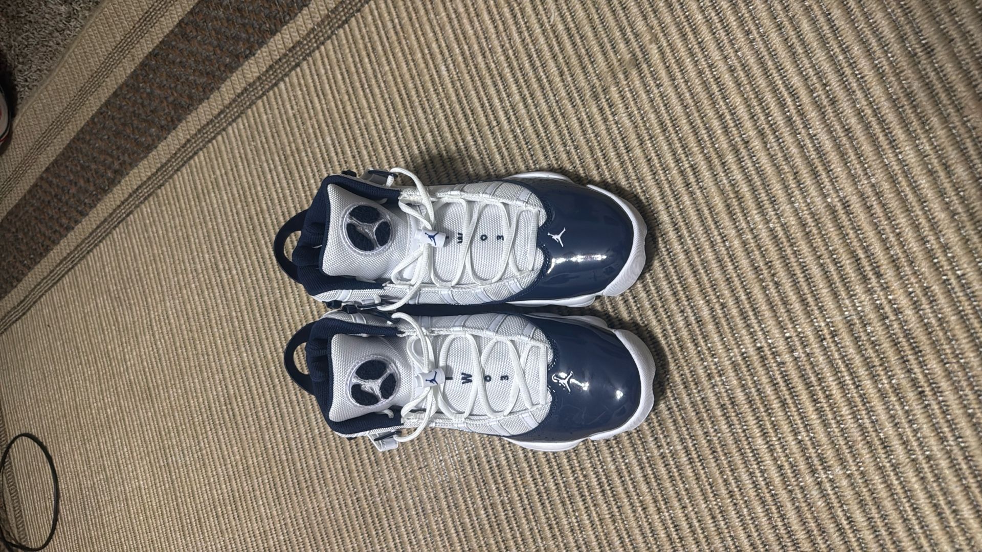 Jordan 6 Rings basketball shoes in a white and navy colorway