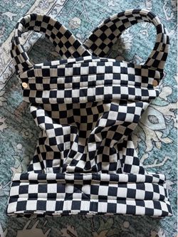 The Monarch Baby Carrier by Mabē,  Ebony Check pattern.