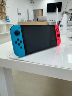 Nintendo Switch - OLED Model w/ Neon Red & Neon Blue Joy-Con (HEG-001) Good