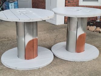 HEAVY WOODEN SPOOL TABLES WITH A PLACE TO HOLD AN UMBRELLA