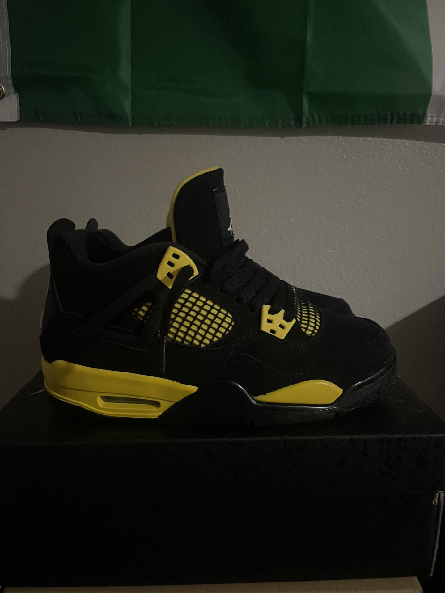 Yellow Thunder Jordan 4s