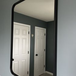 2 Black Metal Framed Mirrors