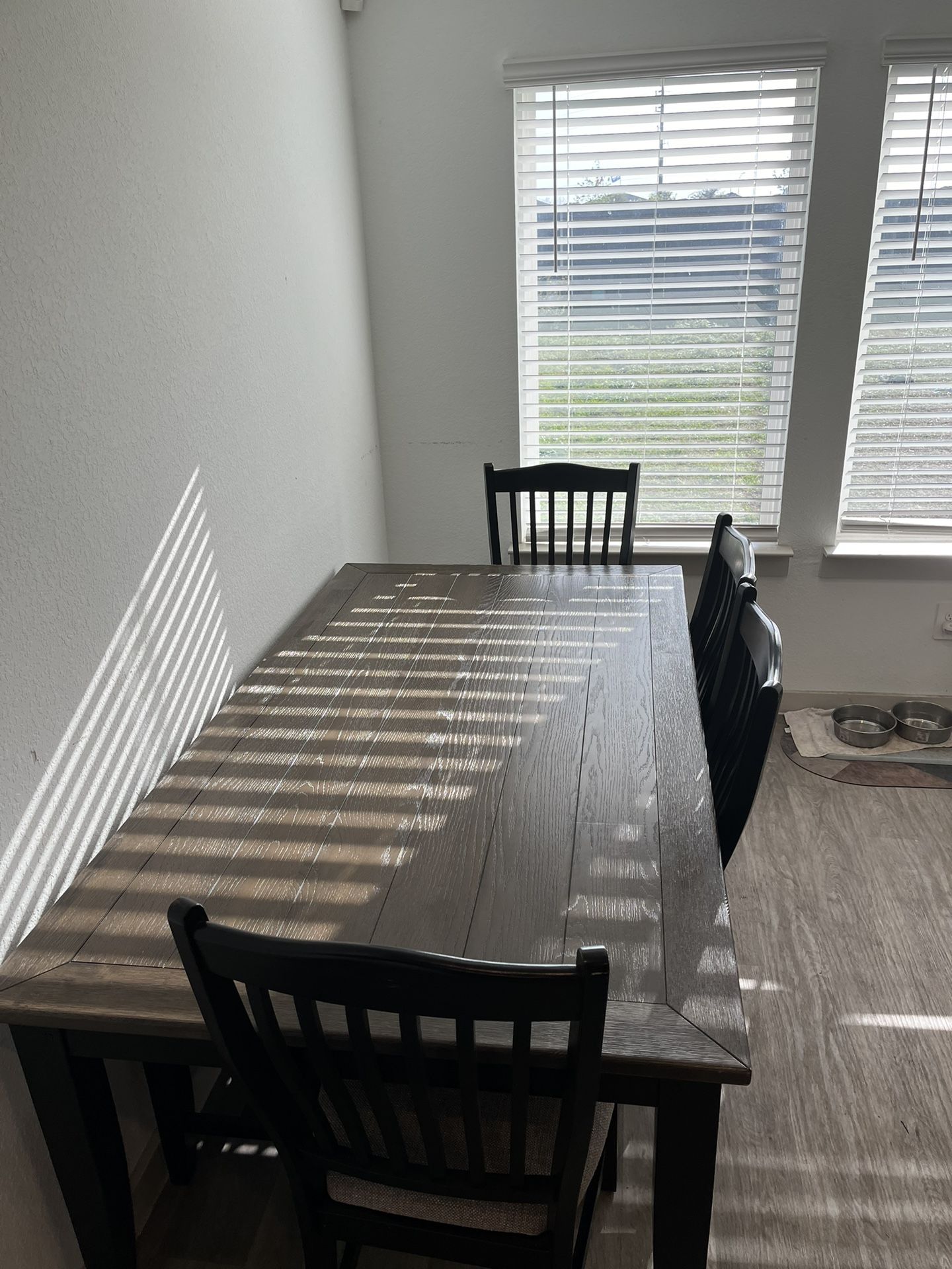 Kitchen table with four chairs and one bench