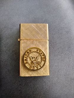 14 k gold plated florentine lighter.