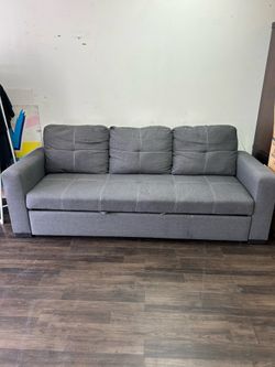 Grey sofa bed firm price $40 pick up in pomona has to be spot cleaned