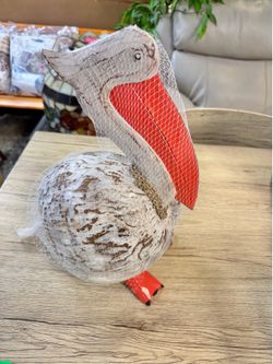 New handcrafted carved coconut pelican
