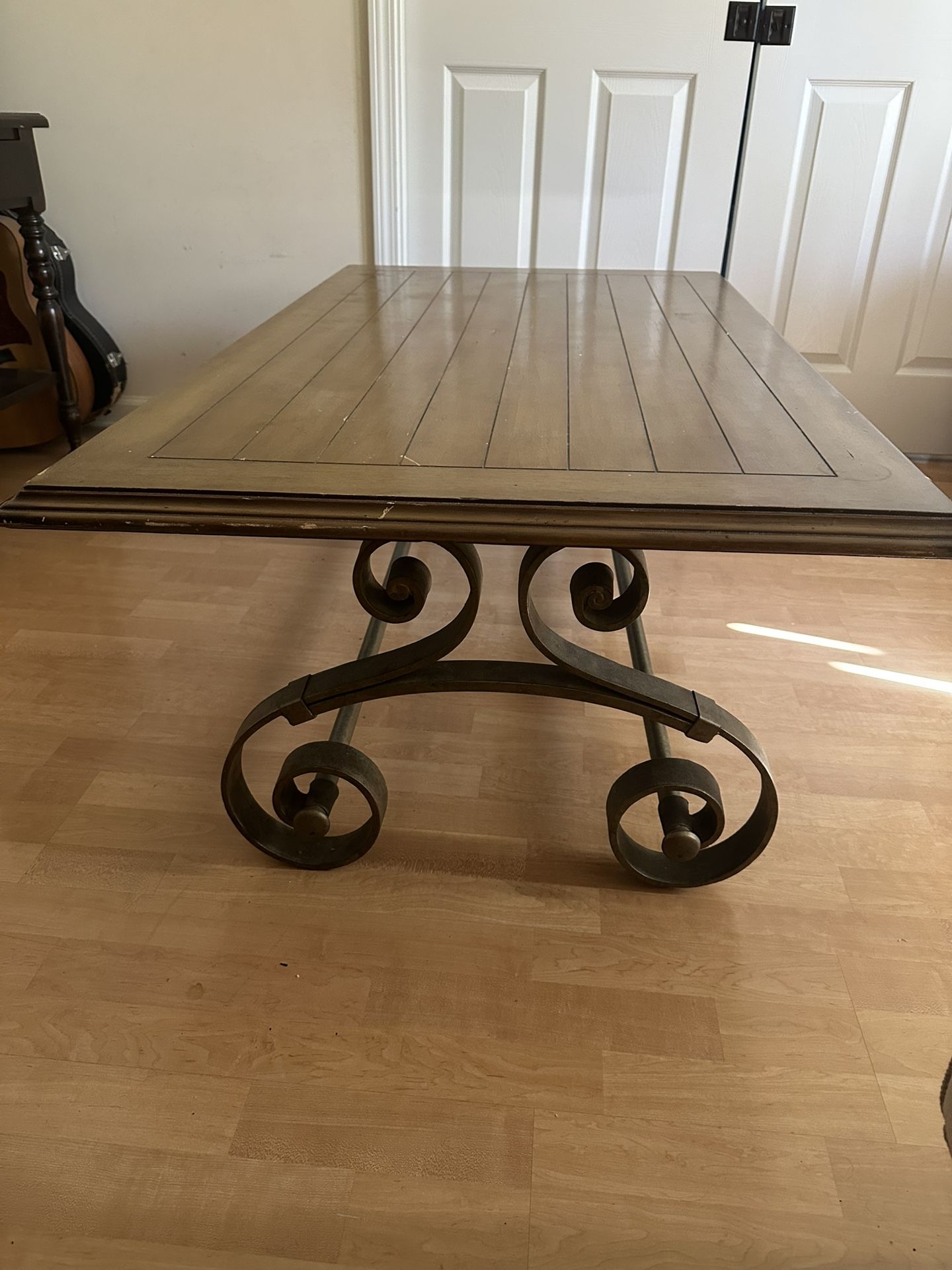 Wood coffee table with rod iron paisley legs