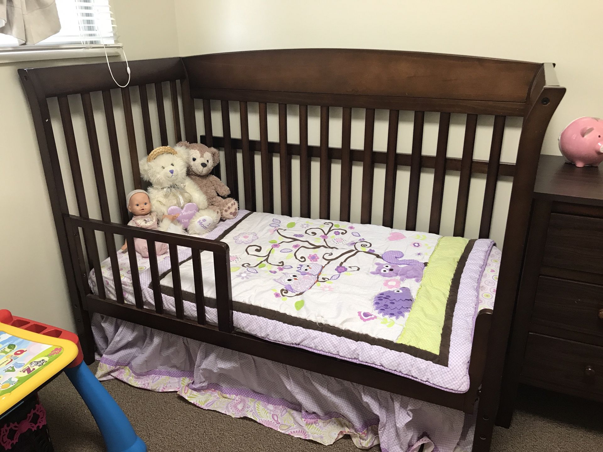 Baby bed, dresser, and changing table.