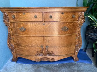 antique turn-of-the-century quarter-sawn tiger oak serpentine sideboard.