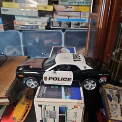 Metal cop car in good shape, missing top light