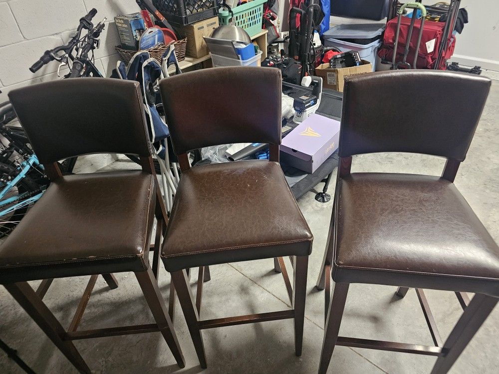 3 Brown Leather Bar Stools For Sale $60