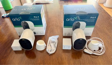 (2) Arlo Pro 4 2k Spotlight Cameras with Pro Smart Hub and accessories