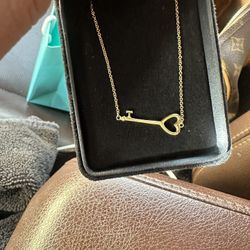 Tiffany’s Gold East-west Key Necklace. 