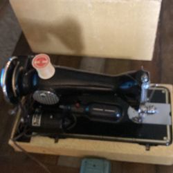 Vintage sewing machine with case