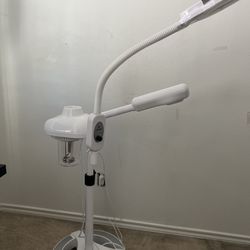 Facial steamer with magnifying lamp/light
