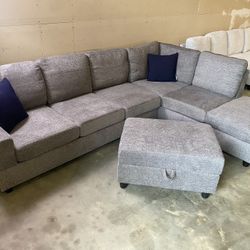 FREE DELIVERY AND INSTALLATION - Brand New in box gray Sectional and Ottoman (Look my profile)