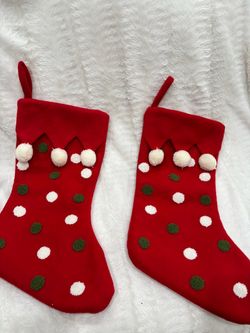 Two hobby lobby Christmas stockings with Pom poms