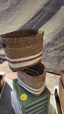 Two storage baskets with handles.