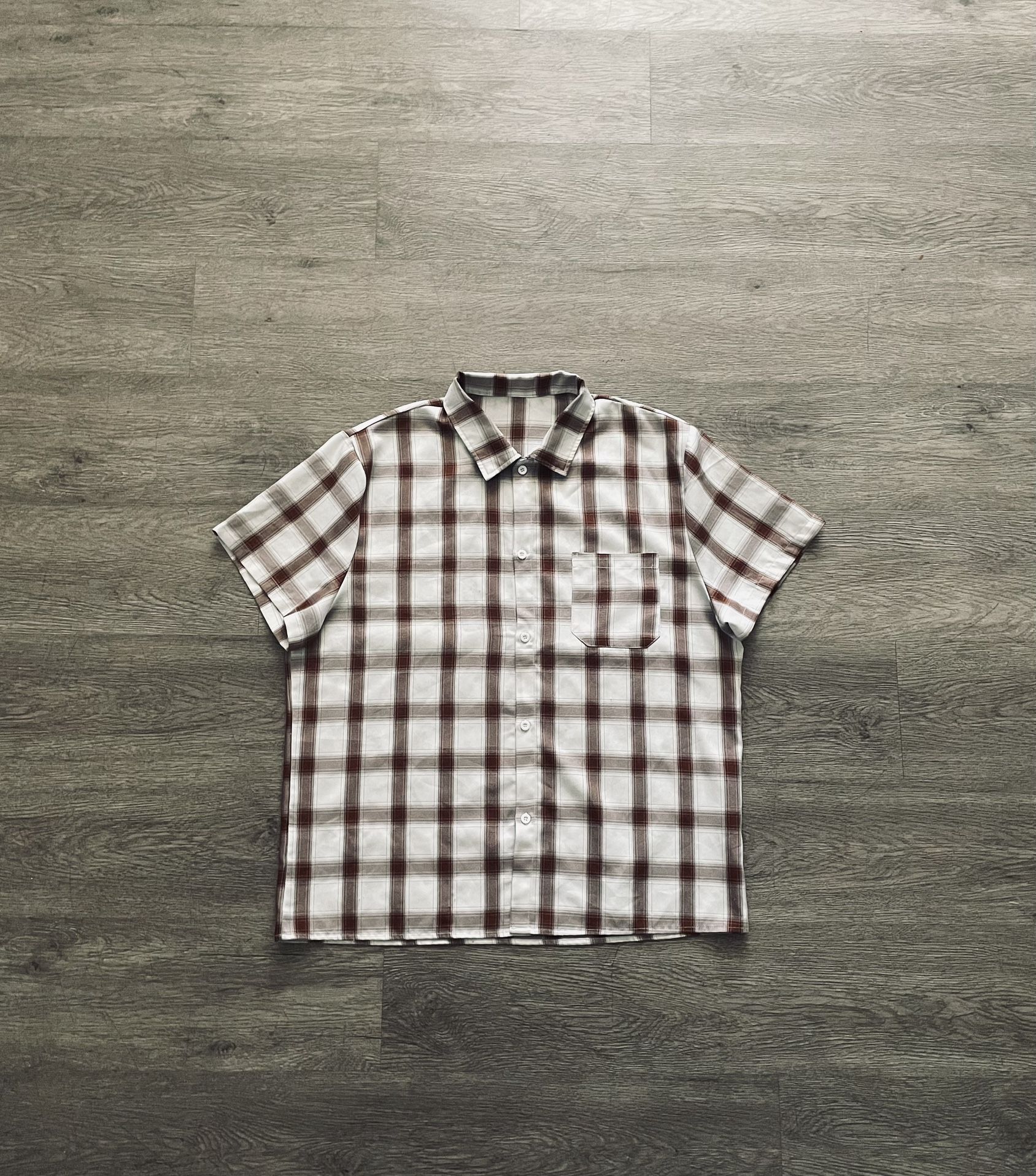 brown and white plaid button-up shirt 