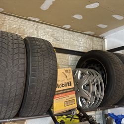 4 x 15” Bridgestone Blizzak snow tires, rims and hub caps